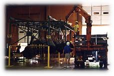 Thousand pound bags are unloaded for strictly monitored processing